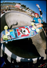 Tony Hawk with a red helmet Skateboarding off the lip of small cement pool at Del Mar Skate Ranch